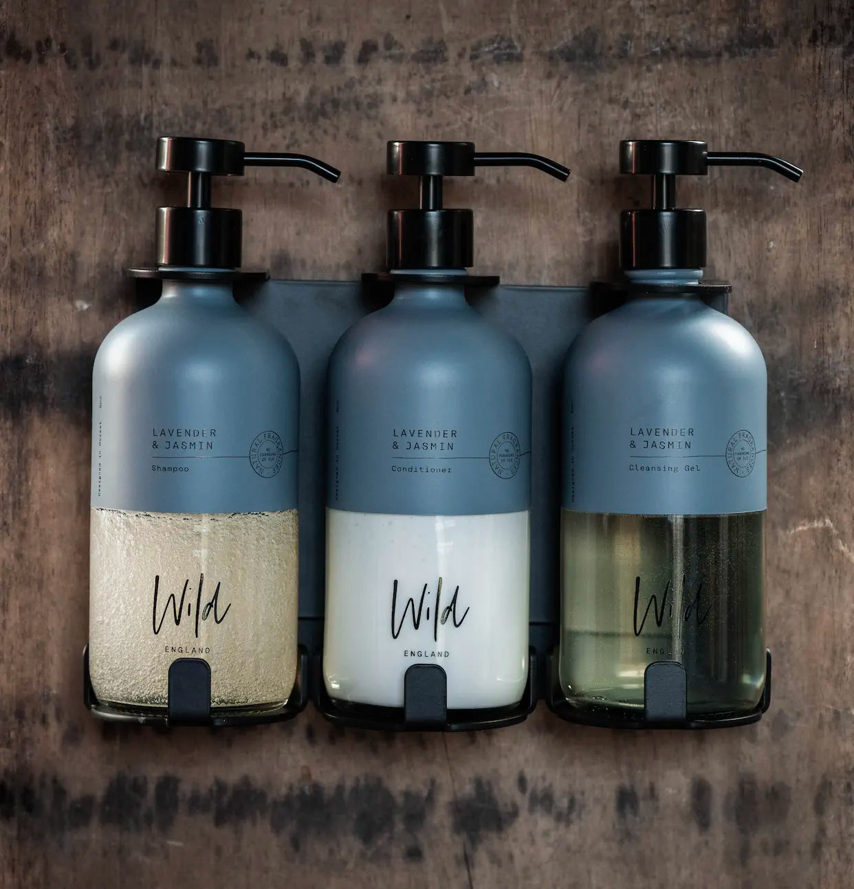 Matt Black Triple Bracket holding Lavender and Eucalyptus Shampoo, Conditioner and Cleansing Gel