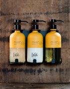 Matt Black Triple Bracket holding Sweet Orange and Cardamom Shampoo, Conditioner and Cleansing Gel