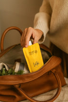 Wild England natural hand and body wash travel pouch 50ml tucked into a handbag