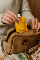 Wild England natural hand and body wash travel pouch 50ml tucked into a small travel bag